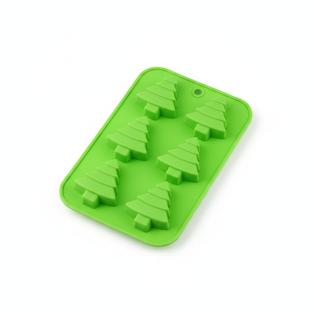 Clean studio photo of the green six cavity 3D Christmas tree silicone mould on white