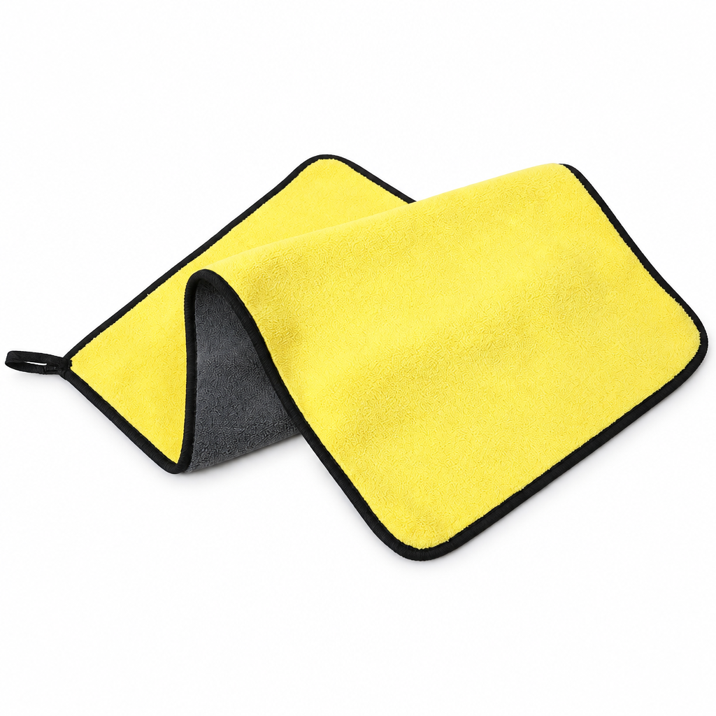 Yellow and grey microfibre towel on white
